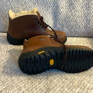 UGG AUSTRALIA- genuine leather upper, sheepskin lining.  Worn only once.